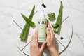 Clarifying Gel flat lay with hands